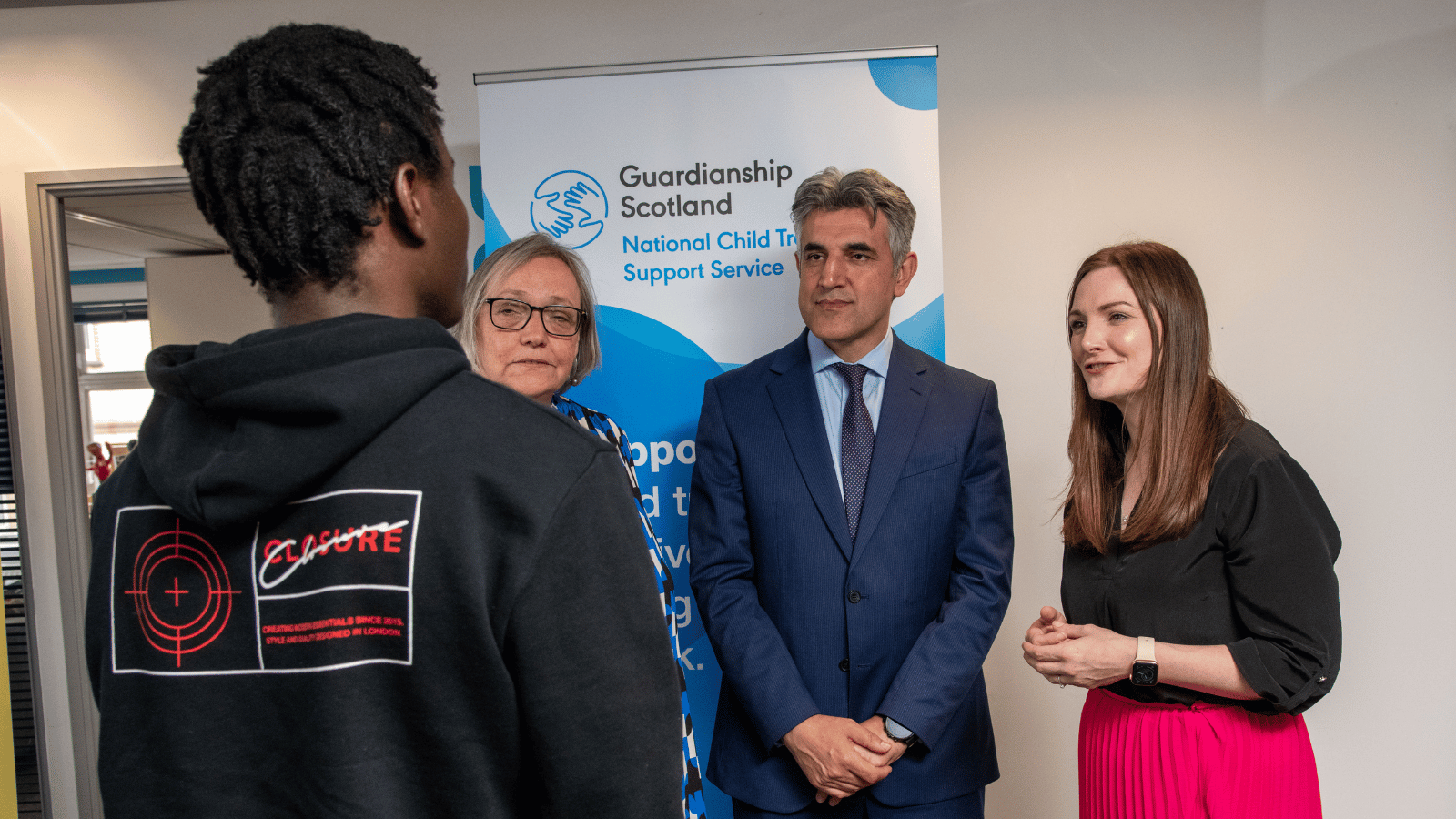 Scottish Government Minister for Children, Natalie Don, chats with young people supported by Guardianship Scotland
