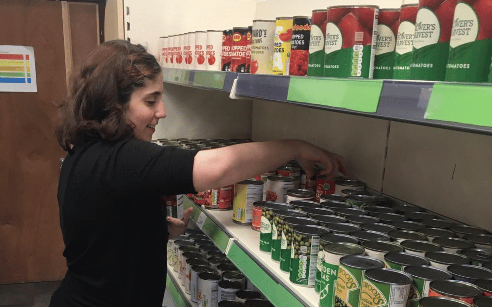 Christina now volunteers at a food pantry run by Greater Pollok Services